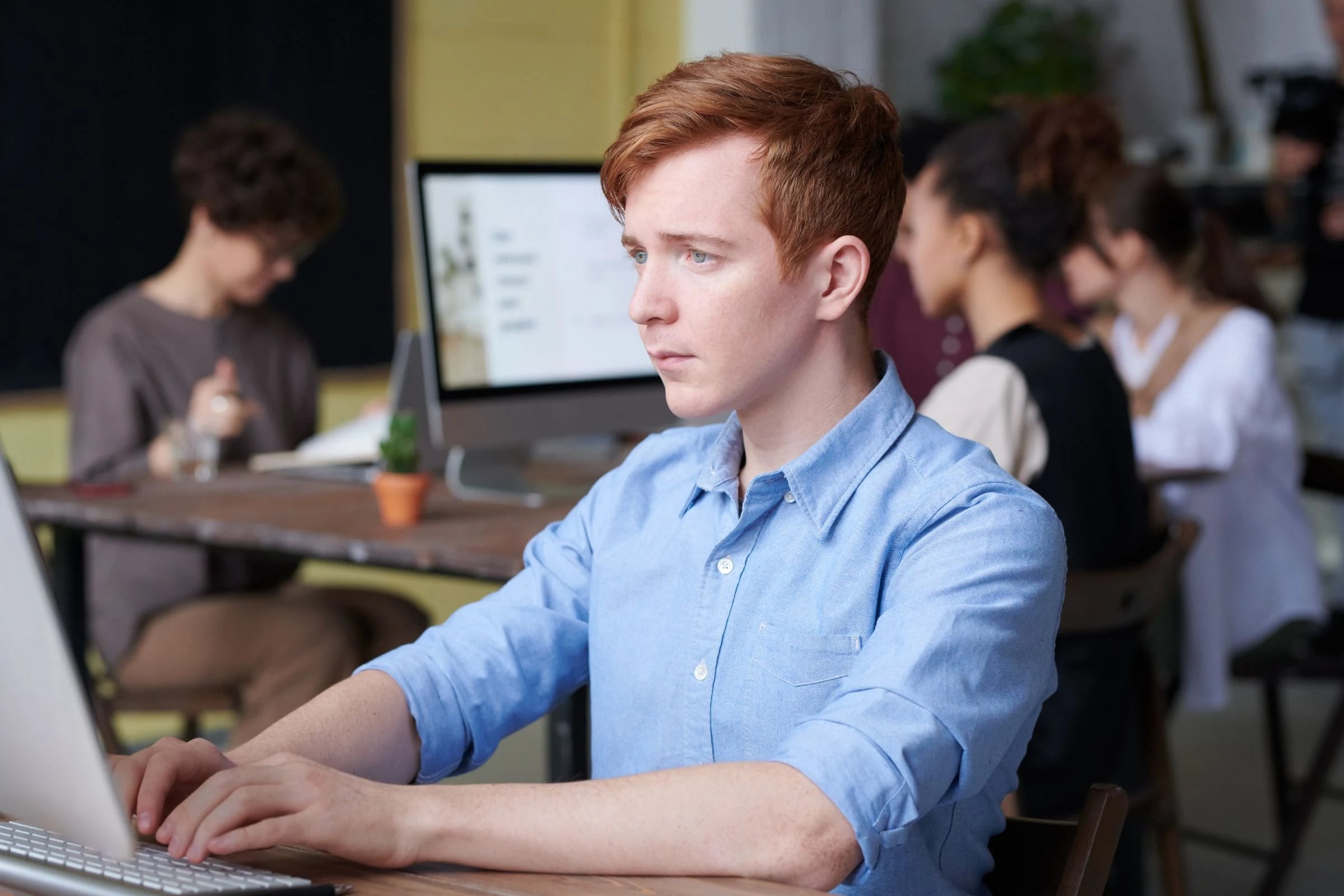 A professional working at a desktop computer
