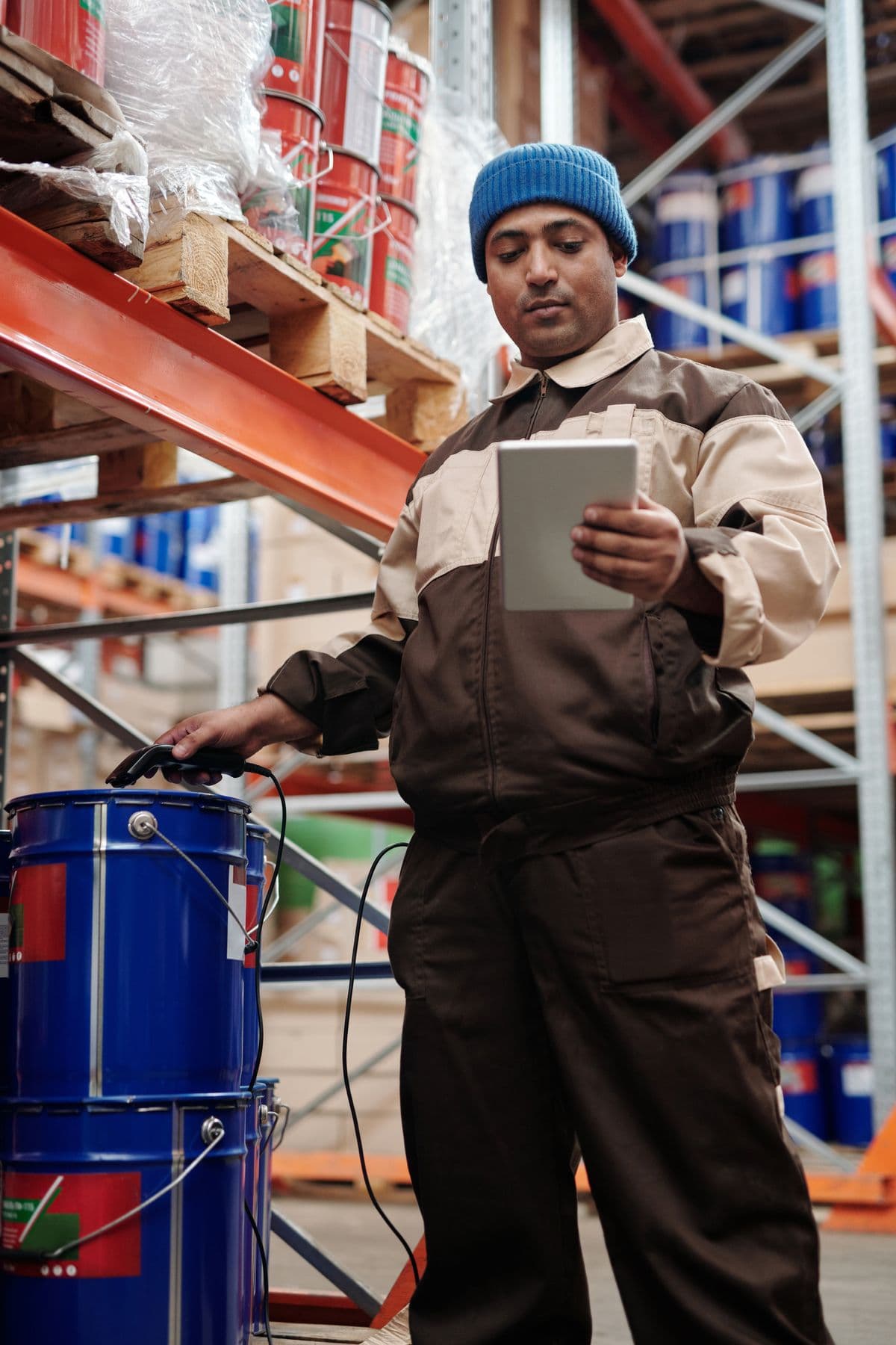 Warehouse worker checking order information on a tablet